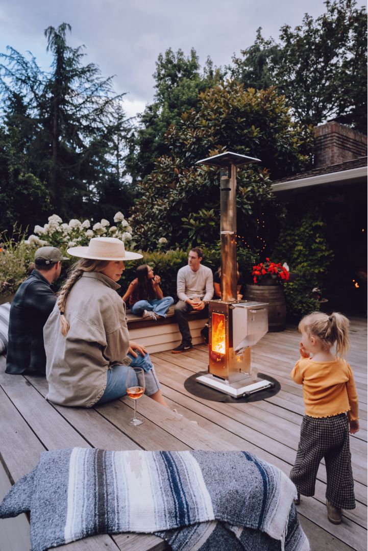 The Big Timber patio heater warming a family