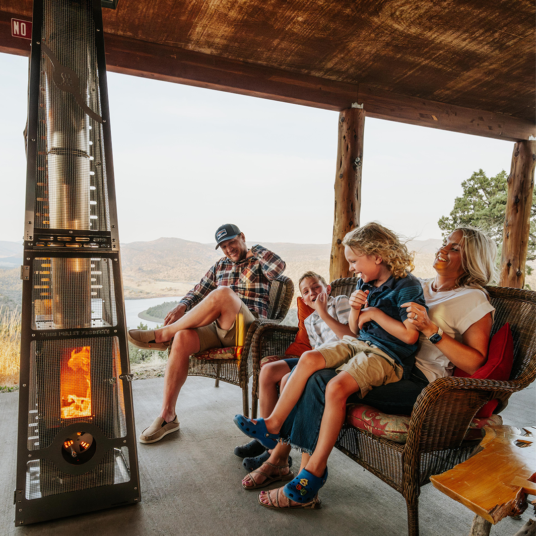 Family enjoying Revere Elite Outdoor Fireplaces